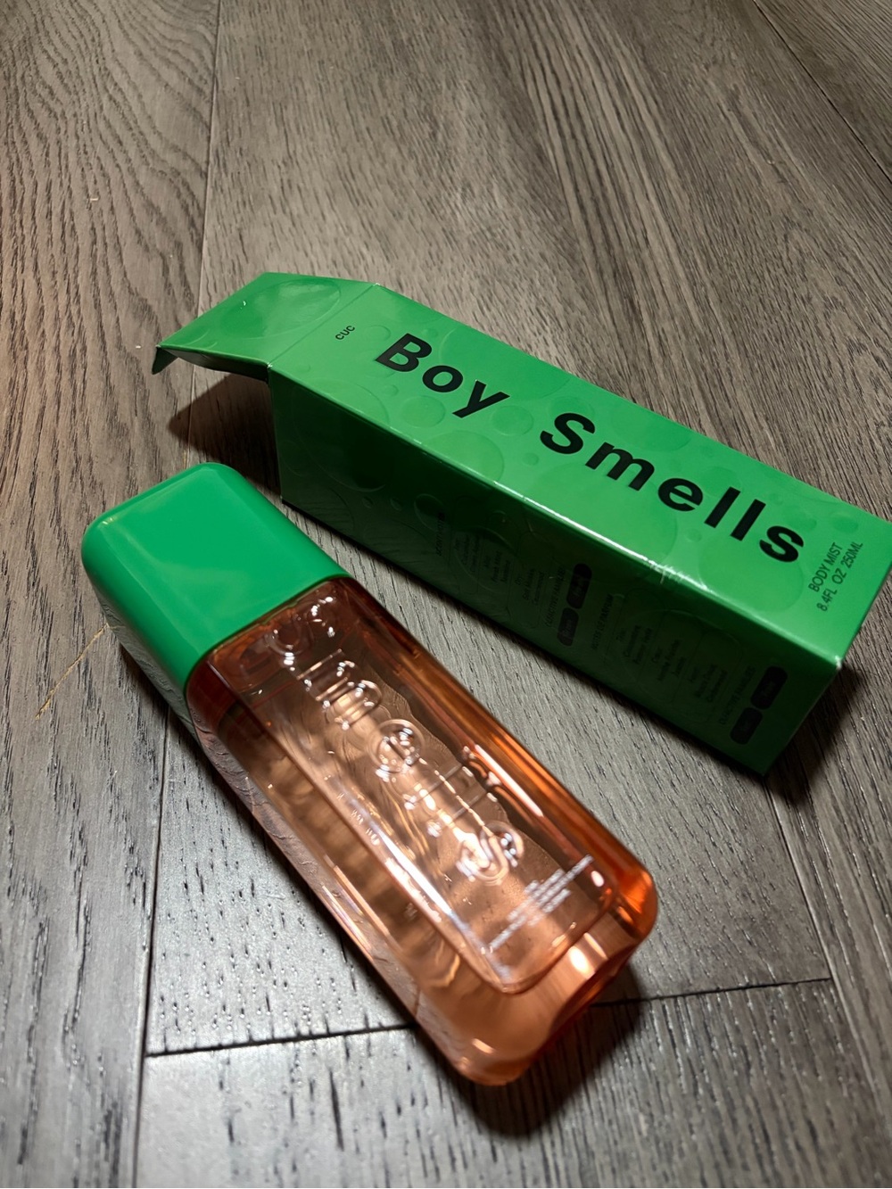 Boy smells cucumber body mist